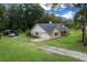 Single-story home with a carport and a spacious driveway at 26 Count Fleet Dr, Ocala, FL 34482
