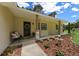 Welcoming front porch with decorative wreath and bench seating at 26 Count Fleet Dr, Ocala, FL 34482
