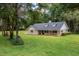 Charming single-story home featuring dormer windows and a well-maintained lawn at 26 Count Fleet Dr, Ocala, FL 34482