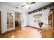 Office boasts bright light, hardwood floors, and built in desk at 26 Count Fleet Dr, Ocala, FL 34482