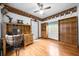 Bright home office featuring desk, shelves, and wooden floors at 26 Count Fleet Dr, Ocala, FL 34482