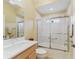 Well-lit bathroom with a shower and tub combination at 2721 Day Lily Run, The Villages, FL 32162