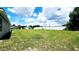 Lush green backyard surrounded by privacy fence, perfect for outdoor activities at 2883 Sw 146Th Place Rd, Ocala, FL 34473