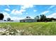 Large, green backyard enclosed by a pristine white privacy fence adds security at 2883 Sw 146Th Place Rd, Ocala, FL 34473