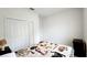 Bedroom with closet and blanket on bed at 2883 Sw 146Th Place Rd, Ocala, FL 34473