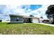 Picture of a one-story home with a well-maintained lawn and a two-car garage at 2883 Sw 146Th Place Rd, Ocala, FL 34473
