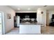 Modern kitchen with granite countertops, dark wood cabinets, and stainless steel appliances at 2883 Sw 146Th Place Rd, Ocala, FL 34473