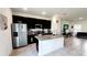 A bright kitchen is showcased, complete with granite countertops, stainless steel appliances and tile floors at 2883 Sw 146Th Place Rd, Ocala, FL 34473