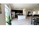 Bright kitchen with stainless steel appliances and granite countertops and large tile flooring at 2883 Sw 146Th Place Rd, Ocala, FL 34473