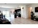 Open-concept living space with tile flooring seamlessly connecting the living, dining, and kitchen areas at 2883 Sw 146Th Place Rd, Ocala, FL 34473