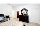 Bedroom featuring a large ornate bed, dark wood furniture, and tiled flooring at 2883 Sw 146Th Place Rd, Ocala, FL 34473