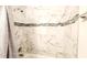 Modern shower featuring marble style tile and chrome fixtures at 2883 Sw 146Th Place Rd, Ocala, FL 34473