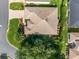 Aerial view of the home showcasing the roof and landscaping at 3001 Hillside Ln, The Villages, FL 32162