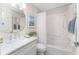Bright bathroom featuring tub/shower combo, stylish faucet and modern decor at 3001 Hillside Ln, The Villages, FL 32162