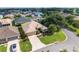 Beautifully landscaped home featuring a paved driveway and attached two-car garage at 3001 Hillside Ln, The Villages, FL 32162