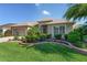 Charming home with a well-maintained lawn and tiered landscaping in the front yard at 3001 Hillside Ln, The Villages, FL 32162