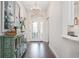 Home entryway with hardwood floors, decorative glass front door, and stylish decor at 3001 Hillside Ln, The Villages, FL 32162