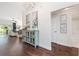 Hallway with hardwood floors, stylish decor and access to living spaces and a bathroom at 3001 Hillside Ln, The Villages, FL 32162