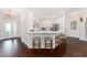 Bright kitchen with white cabinets, stainless steel appliances, breakfast bar and modern finishes at 3001 Hillside Ln, The Villages, FL 32162