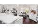Bright kitchen with white countertops, stainless steel appliances, and dining nook at 3001 Hillside Ln, The Villages, FL 32162