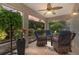 Relaxing screened patio with ceiling fan and comfortable seating, perfect for enjoying the outdoors at 3001 Hillside Ln, The Villages, FL 32162