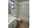 This bathroom offers tile flooring, a tub, and a vanity with sink with ample counter space at 3801 Sw 147Th Lane Rd, Ocala, FL 34473