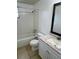 This bathroom offers tile flooring, a tub, and a vanity with marble countertops at 3801 Sw 147Th Lane Rd, Ocala, FL 34473