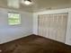 This bedroom features a large window and spacious closet for optimal storage and natural lighting at 3801 Sw 147Th Lane Rd, Ocala, FL 34473