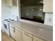 Well-lit kitchen with a pass-through to the living area, offering connectivity and convenience at 3801 Sw 147Th Lane Rd, Ocala, FL 34473