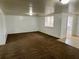 Neutral living room with carpet, ideal for relaxation, and has an archway leading to the kitchen at 3801 Sw 147Th Lane Rd, Ocala, FL 34473