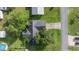 Aerial view showcasing the home's roof, driveway, and landscaping at 42 Almond Dr, Ocala, FL 34472