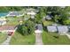 An aerial perspective of the home situated on a lot with mature trees and green grass at 42 Almond Dr, Ocala, FL 34472