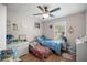 Cozy bedroom with a ceiling fan, natural light, and twin beds providing a comfortable and inviting space at 42 Almond Dr, Ocala, FL 34472