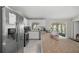 Bright kitchen features stainless steel appliances, a large island, and white cabinets at 42 Almond Dr, Ocala, FL 34472