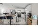 Modern kitchen with stainless steel appliances, granite counters, and breakfast bar at 42 Almond Dr, Ocala, FL 34472