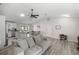 Open-concept living area with light wood floors connecting to the kitchen island at 42 Almond Dr, Ocala, FL 34472