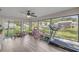Enclosed sunroom provides abundant natural light and overlooks the lush backyard at 42 Almond Dr, Ocala, FL 34472