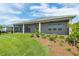 The backyard has a screened in lanai with ceiling fans, providing a comfortable and relaxing space at 4419 Nw 54Th Ter, Ocala, FL 34482