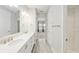 Bathroom with double sinks, lots of counter space, a walk-in closet, and an adjacent bedroom at 4419 Nw 54Th Ter, Ocala, FL 34482
