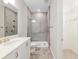 Modern bathroom features a glass-enclosed shower and a vanity with contemporary fixtures and finishes at 4419 Nw 54Th Ter, Ocala, FL 34482