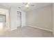Comfortable bedroom with carpet, ceiling fan, and closet, providing a relaxing retreat at 4419 Nw 54Th Ter, Ocala, FL 34482