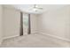 Spacious bedroom featuring neutral tones, carpet flooring, and a ceiling fan for comfortable living at 4419 Nw 54Th Ter, Ocala, FL 34482