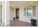 Covered porch with modern, decorative front door and sidelight window at 4419 Nw 54Th Ter, Ocala, FL 34482