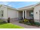 Front entrance features inviting columns, neutral paint, and well-maintained landscaping at 4419 Nw 54Th Ter, Ocala, FL 34482