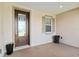 Covered entryway features a modern door, a side window, and a stylish planter accenting the home's curb appeal at 4419 Nw 54Th Ter, Ocala, FL 34482