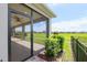 View from yard of the screened lanai, complete with ceiling fans and views of green space at 4419 Nw 54Th Ter, Ocala, FL 34482