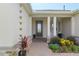 Close-up of front door, showcasing decorative columns and colorful landscaping at 4419 Nw 54Th Ter, Ocala, FL 34482
