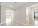 Bright hallway with tile floors leads to the open living area and other rooms at 4419 Nw 54Th Ter, Ocala, FL 34482