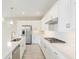 Modern kitchen with white cabinets, stainless steel appliances, and a gas cooktop perfect for cooking enthusiasts at 4419 Nw 54Th Ter, Ocala, FL 34482