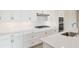 Bright kitchen with white cabinets, stainless steel appliances, and sleek white countertops at 4419 Nw 54Th Ter, Ocala, FL 34482